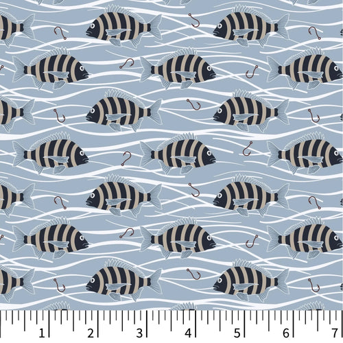 Pattern of striped fish on a blue background with a ruler at the bottom.